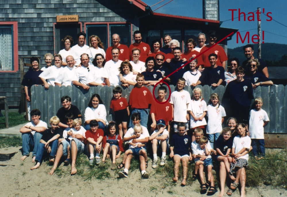 1997 family reunion: extended family in front of the shared coast house, with a hand-drawn arrow pointing to Dan